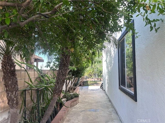 16461 Medinah St, Fontana, CA 92336 - view of side of home with stucco siding