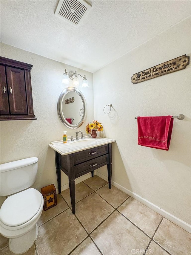 741 Ocotillo Rd, Blythe, CA 92225 - half bath with tile patterned floors, vanity, and a textured ceiling