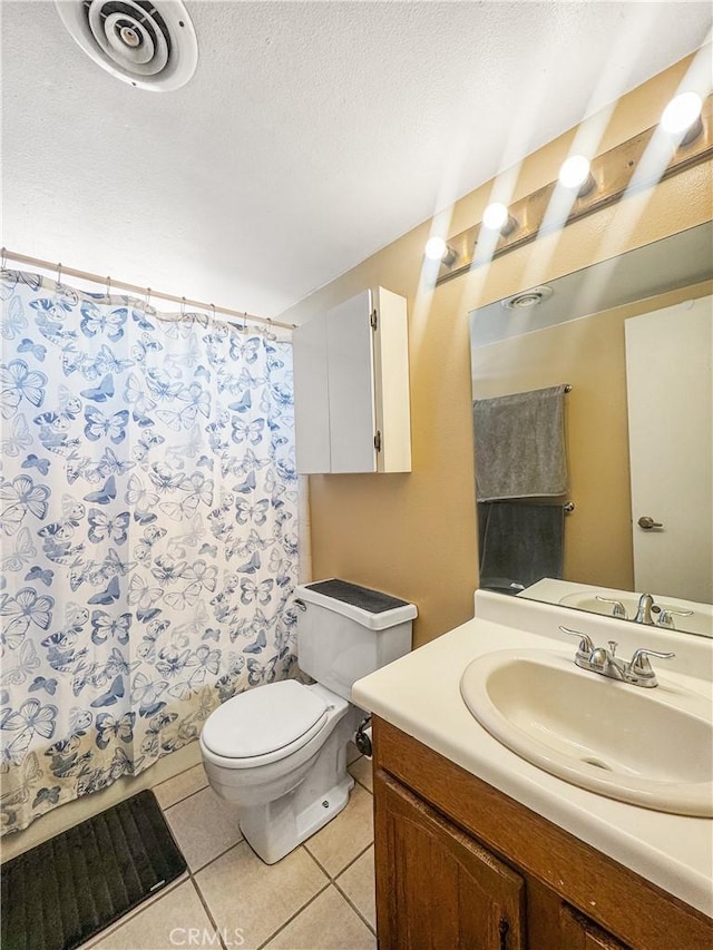 741 Ocotillo Rd, Blythe, CA 92225 - full bathroom featuring tile patterned flooring, vanity, a shower with shower curtain, and a textured ceiling