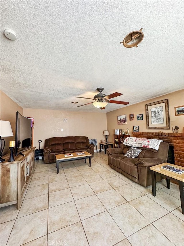 741 Ocotillo Rd, Blythe, CA 92225 - living room featuring a ceiling fan, a textured ceiling, and light tile patterned flooring