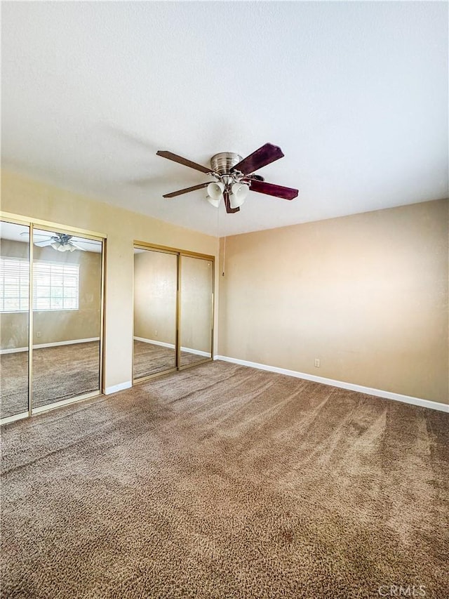 741 Ocotillo Rd, Blythe, CA 92225 - unfurnished bedroom with multiple closets, carpet, and ceiling fan