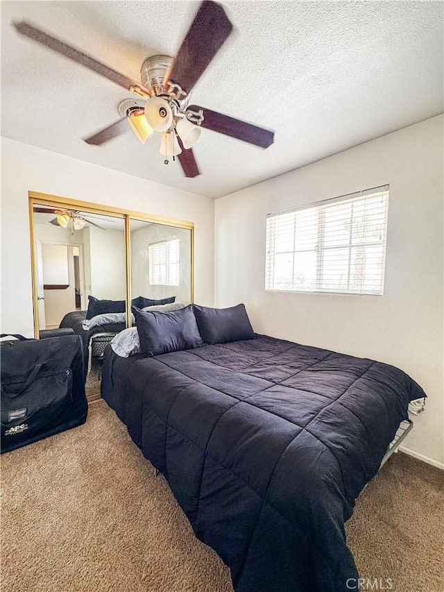 741 Ocotillo Rd, Blythe, CA 92225 - carpeted bedroom with a closet, a textured ceiling, and ceiling fan