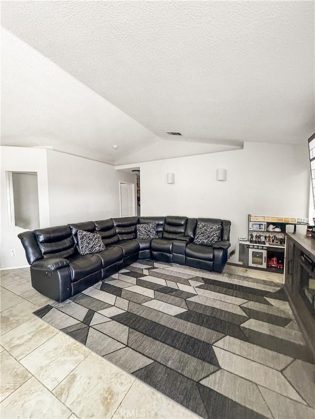 204 Shaded Palm, Blythe, CA 92225 - living area featuring vaulted ceiling and a textured ceiling