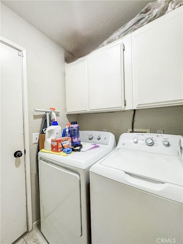 204 Shaded Palm, Blythe, CA 92225 - laundry room with washing machine and dryer, cabinet space, a textured wall, and a textured ceiling