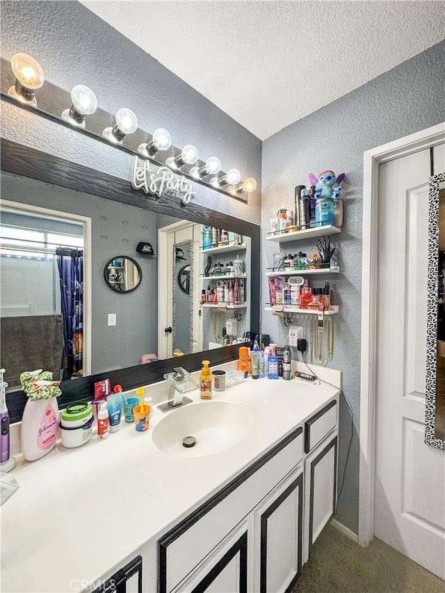 204 Shaded Palm, Blythe, CA 92225 - bathroom featuring a textured wall, a textured ceiling, and vanity
