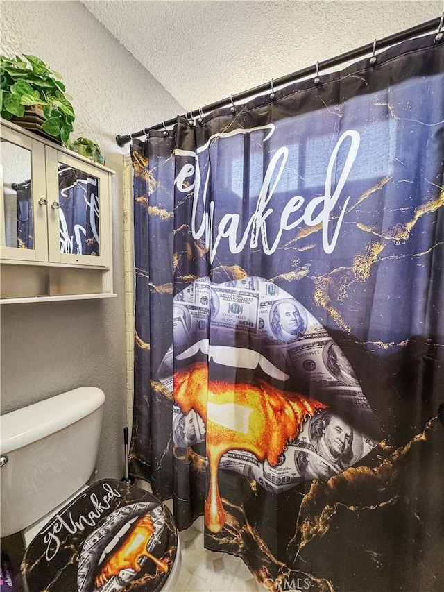 204 Shaded Palm, Blythe, CA 92225 - bathroom with a textured ceiling, a textured wall, and curtained shower