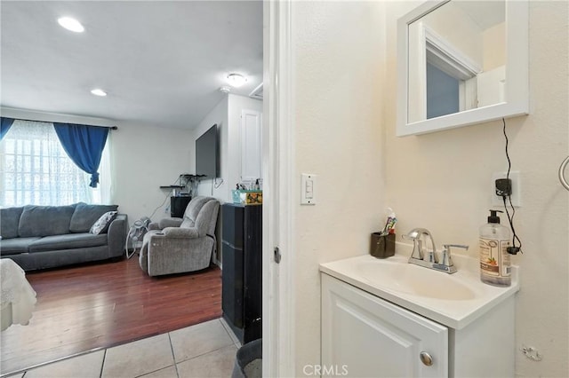 711 E 118th St, Los Angeles, CA 90059 - bathroom featuring tile patterned floors and vanity