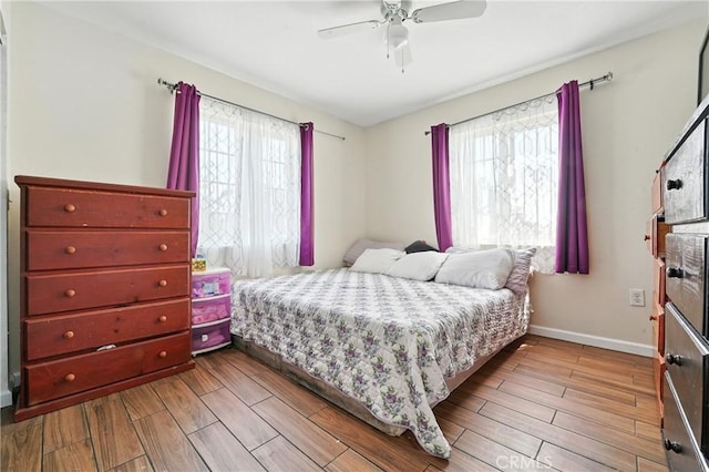 711 E 118th St, Los Angeles, CA 90059 - bedroom with wood finished floors and ceiling fan