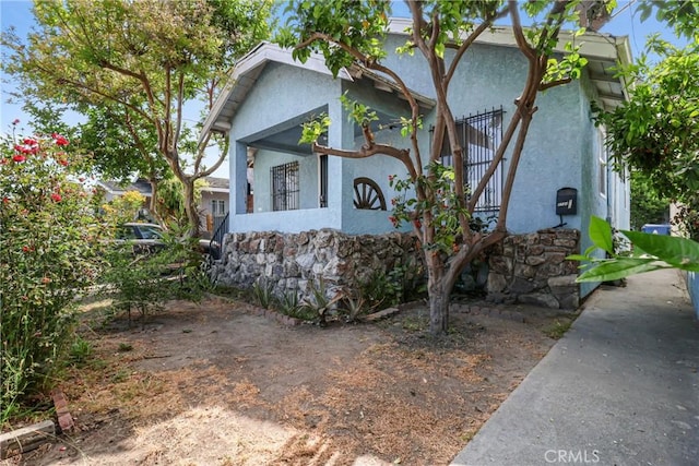 2734 S Redondo Blvd, Los Angeles, CA 90016 - view of front of house with stucco siding and stone siding