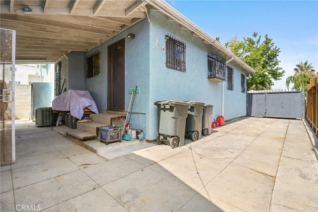 2734 S Redondo Blvd, Los Angeles, CA 90016 - view of property exterior with stucco siding and a patio area