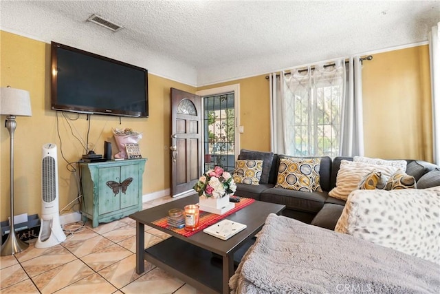 2734 S Redondo Blvd, Los Angeles, CA 90016 - living area featuring a textured ceiling and light tile patterned flooring