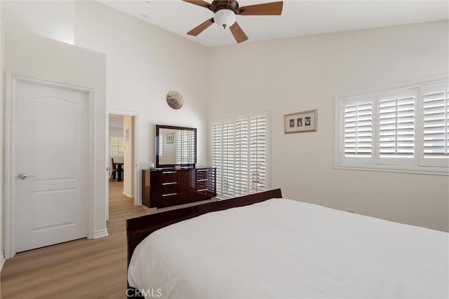 2613 Carnegie Ln # B, Redondo Beach, CA 90278 - bedroom featuring light wood-type flooring, ceiling fan, and a high ceiling