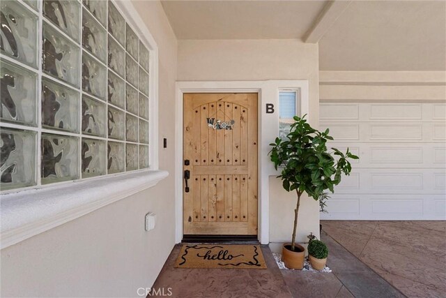 2613 Carnegie Ln # B, Redondo Beach, CA 90278 - doorway to property featuring a garage