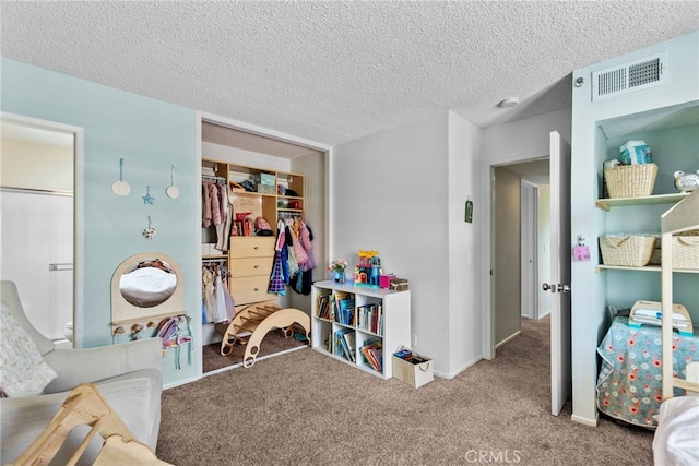17910 River Cir Unit 1, Canyon Country, CA 91387 - carpeted bedroom featuring a textured ceiling, a walk in closet, and connected bathroom