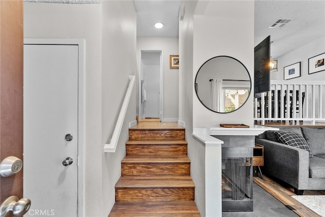 17910 River Cir Unit 1, Canyon Country, CA 91387 - stairway featuring wood finished floors