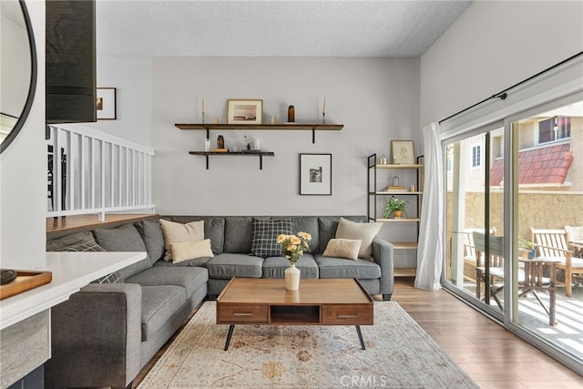 17910 River Cir Unit 1, Canyon Country, CA 91387 - living room with wood finished floors and a textured ceiling