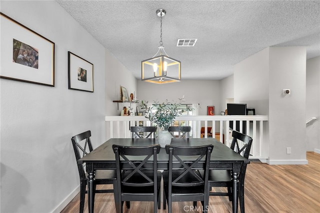 17910 River Cir Unit 1, Canyon Country, CA 91387 - dining area featuring wood finished floors and a textured ceiling
