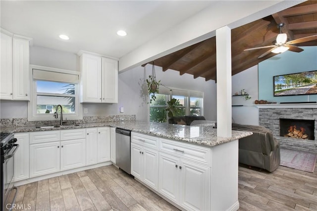 429 S Colfax St, La Habra, CA 90631 - kitchen featuring dishwasher, light wood-style floors, gas range oven, light stone countertops, and recessed lighting