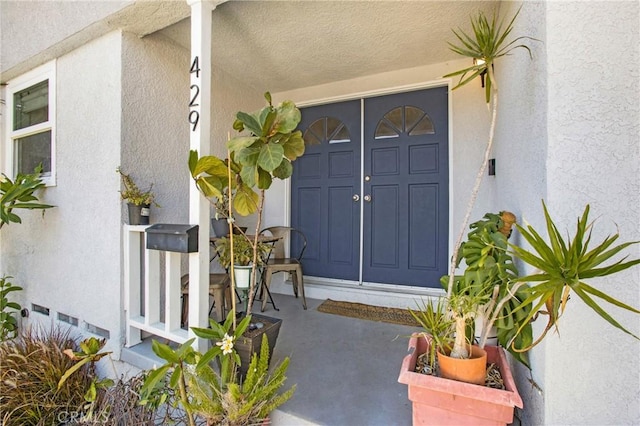 429 S Colfax St, La Habra, CA 90631 - view of exterior entry with stucco siding and covered porch