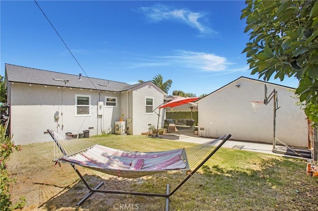 429 S Colfax St, La Habra, CA 90631 - back of house with stucco siding, a patio, and a lawn