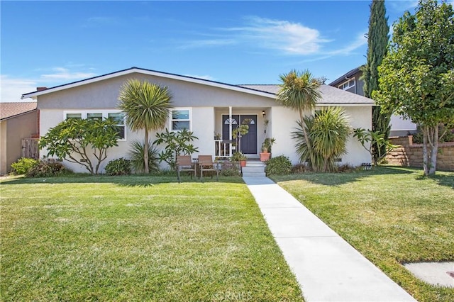 429 S Colfax St, La Habra, CA 90631 - view of front of property featuring stucco siding, a front lawn, and a porch