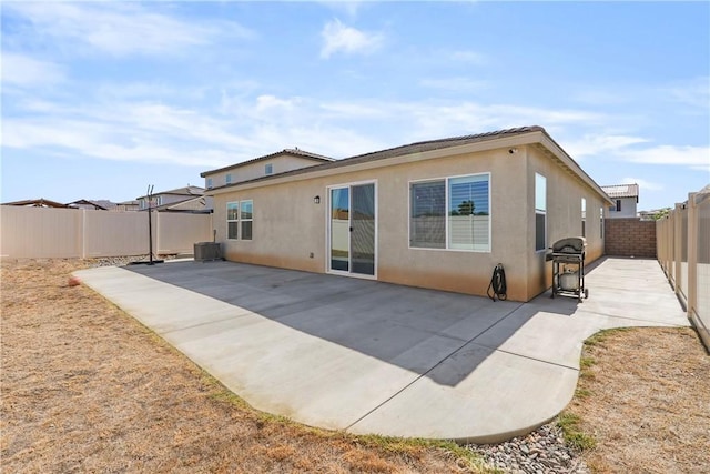 25541 Buckeye Meadow Ln, Homeland, CA 92548 - rear view of property with stucco siding, a fenced backyard, and a patio