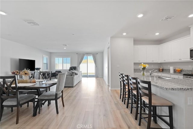25541 Buckeye Meadow Ln, Homeland, CA 92548 - dining area featuring light wood-type flooring and recessed lighting