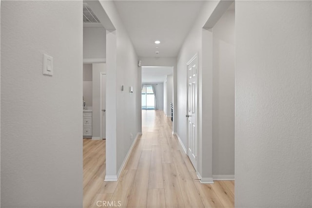 25541 Buckeye Meadow Ln, Homeland, CA 92548 - hall with light wood-style flooring and recessed lighting