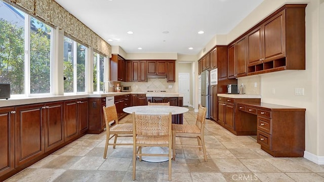 10 Calle Castillo, San Clemente, CA 92673 - kitchen featuring tasteful backsplash, light countertops, recessed lighting, under cabinet range hood, and fridge