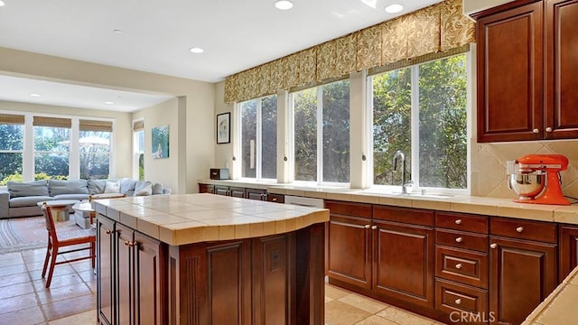 10 Calle Castillo, San Clemente, CA 92673 - kitchen with tile countertops, plenty of natural light, recessed lighting, and a kitchen island
