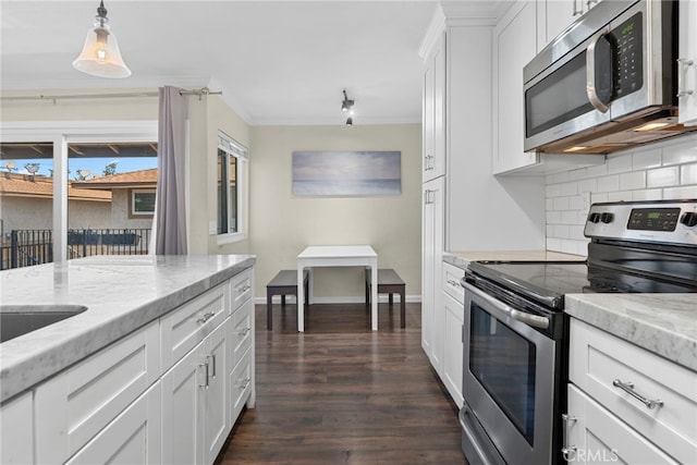 17700 Palo Verde Ave, Cerritos, CA 90703 - kitchen with stainless steel appliances, backsplash, crown molding, dark wood-type flooring, and white cabinets