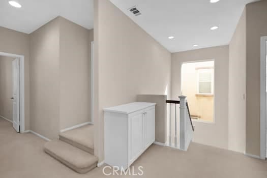 252 W Tulip Tree Ave, Orange, CA 92865 - corridor with an upstairs landing, light colored carpet, and recessed lighting