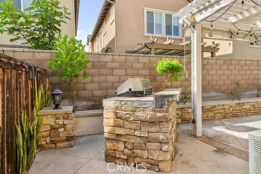 252 W Tulip Tree Ave, Orange, CA 92865 - view of patio / terrace with an outdoor kitchen and a pergola