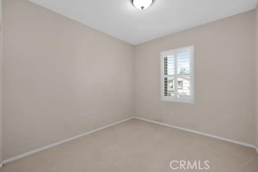 252 W Tulip Tree Ave, Orange, CA 92865 - spare room with baseboards and light carpet