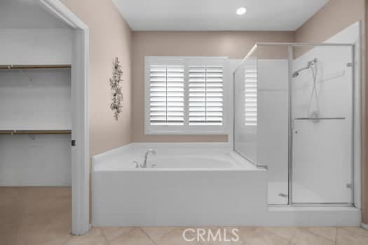 252 W Tulip Tree Ave, Orange, CA 92865 - bathroom featuring a stall shower, a bath, tile patterned floors, and a walk in closet