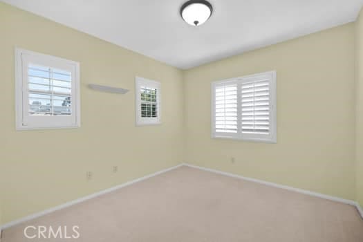 252 W Tulip Tree Ave, Orange, CA 92865 - carpeted spare room featuring baseboards