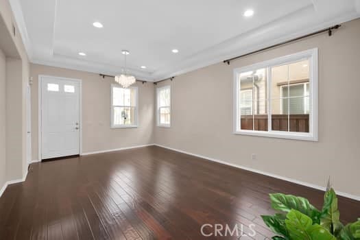 252 W Tulip Tree Ave, Orange, CA 92865 - foyer entrance with hardwood / wood-style floors, a chandelier, recessed lighting, and a raised ceiling