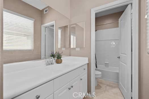 252 W Tulip Tree Ave, Orange, CA 92865 - bathroom featuring vanity, shower / bath combo, and tile patterned flooring