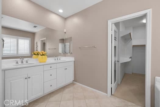 252 W Tulip Tree Ave, Orange, CA 92865 - full bath with double vanity, tile patterned flooring, and a walk in closet