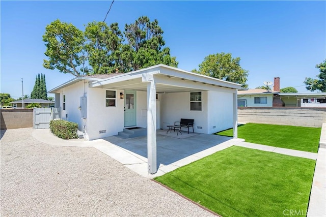 10536 La Mirada Blvd, Whittier, CA 90604 - back of house with stucco siding, crawl space, and a gate