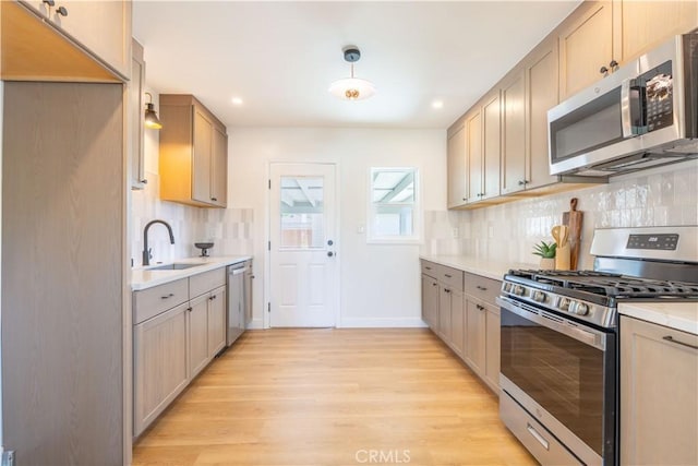 10536 La Mirada Blvd, Whittier, CA 90604 - kitchen with stainless steel appliances, light wood-style floors, backsplash, light countertops, and recessed lighting