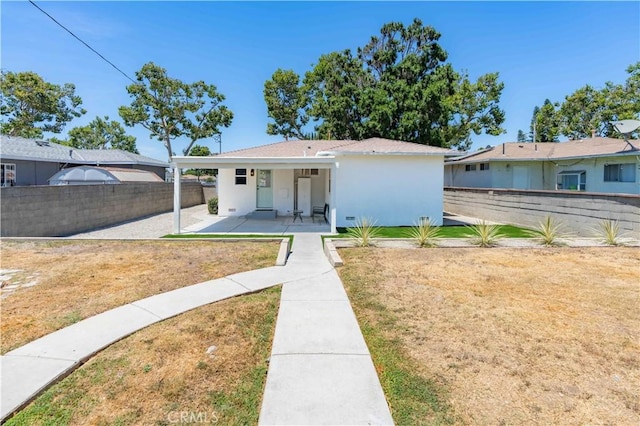 10536 La Mirada Blvd, Whittier, CA 90604 - view of front of house with stucco siding, a fenced backyard, and a patio area