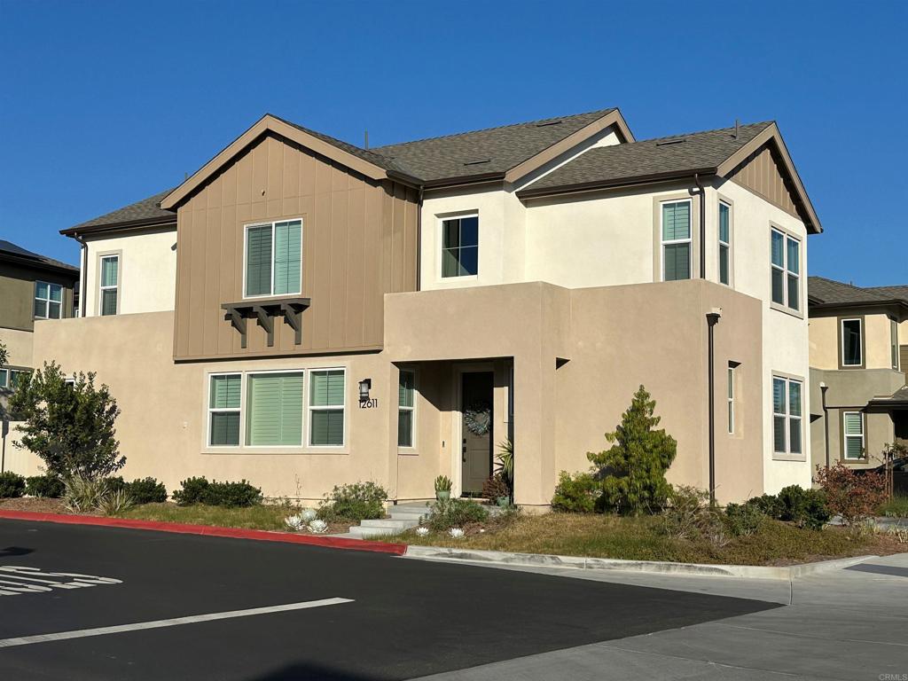 12611 Stella Ln, San Diego, CA 92129 - view of front facade featuring a shingled roof and stucco siding