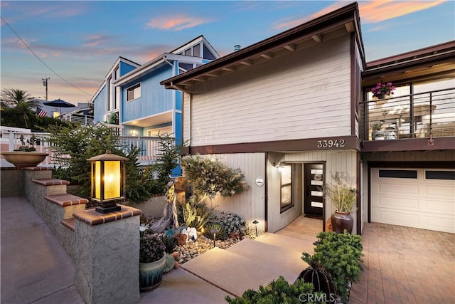 33942 Pequito Dr, Dana Point, CA 92629 - view of front of property with a balcony and a garage