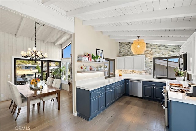 33942 Pequito Dr, Dana Point, CA 92629 - kitchen featuring appliances with stainless steel finishes, blue cabinets, dark wood-style floors, a chandelier, and high vaulted ceiling