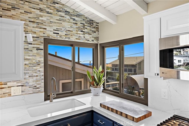 33942 Pequito Dr, Dana Point, CA 92629 - kitchen view of stainless steel microwave, white cabinetry, and light countertops