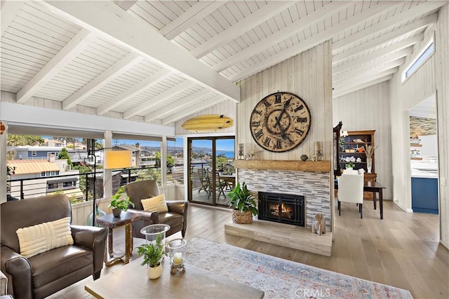33942 Pequito Dr, Dana Point, CA 92629 - living area with high vaulted ceiling, a tiled fireplace, hardwood / wood-style floors, beam ceiling, and wood walls