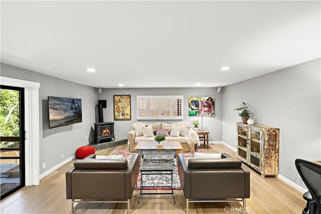 33942 Pequito Dr, Dana Point, CA 92629 - living area with a wood stove, light wood-style floors, and recessed lighting
