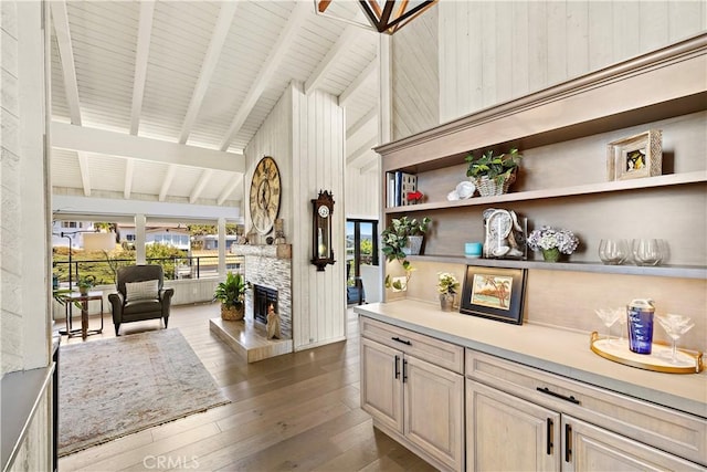 33942 Pequito Dr, Dana Point, CA 92629 - bar with high vaulted ceiling, a fireplace, dark wood-style flooring, beamed ceiling, and wooden walls