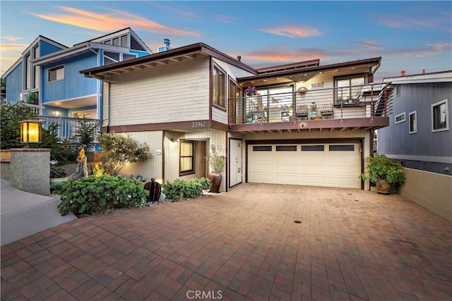 33942 Pequito Dr, Dana Point, CA 92629 - modern home with a balcony, an attached garage, and decorative driveway